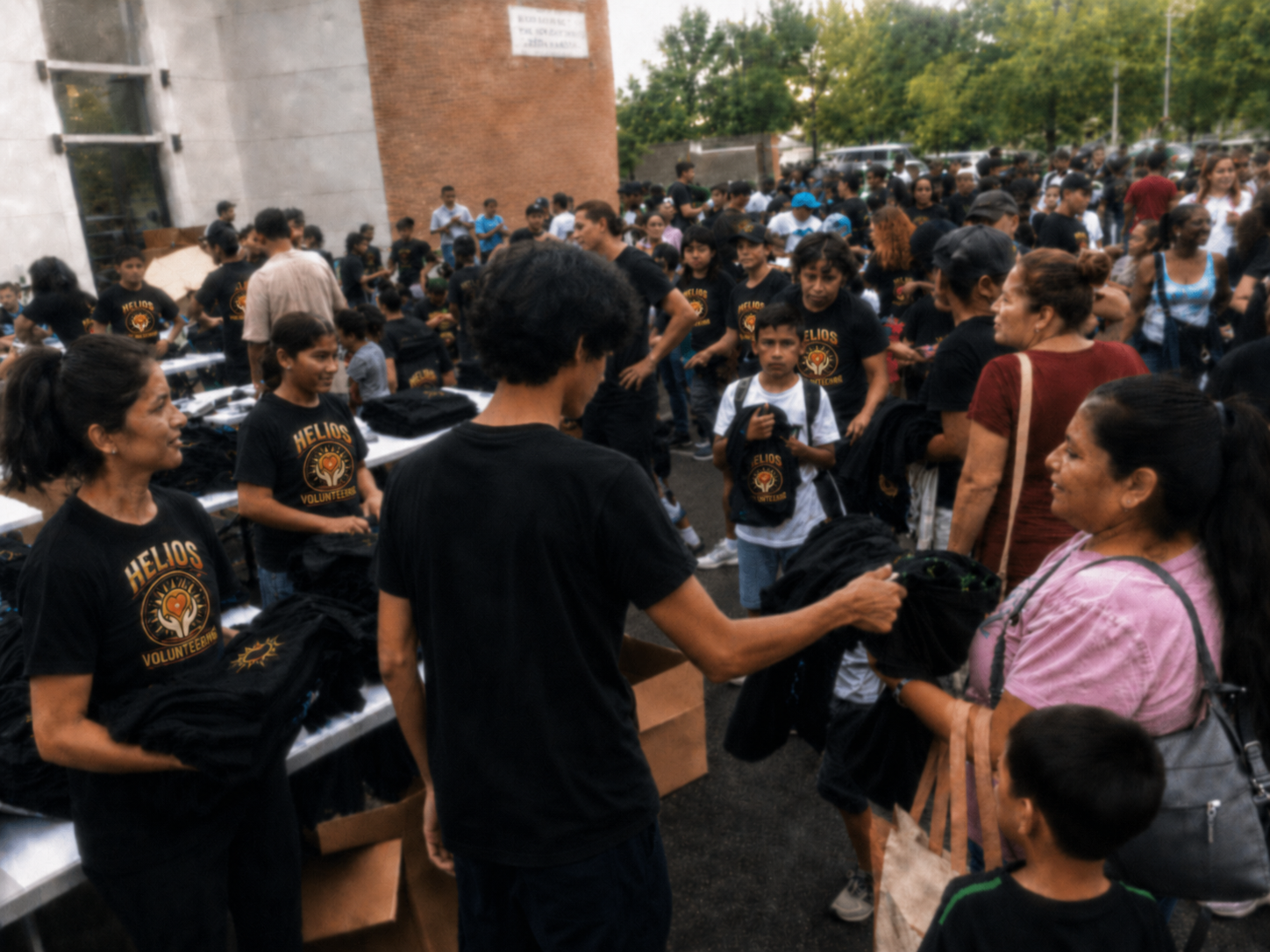 Helios volunteers distributing custom apparel at a community event.